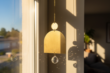 Load image into Gallery viewer, Brass Suncatcher hanging high by window