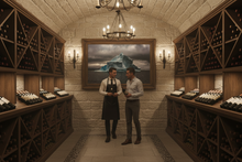 Load image into Gallery viewer, Moody Mountain art print in wine cellar with winery staff