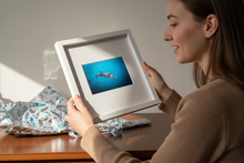 Load image into Gallery viewer, Person admiring unwrapped Mother + Calf Dolphins framed print